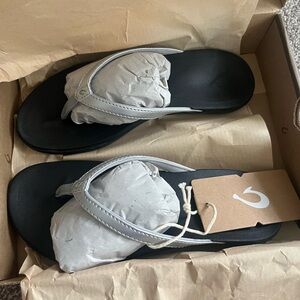 OluKai Ho'opio Sandals in Silver and Black